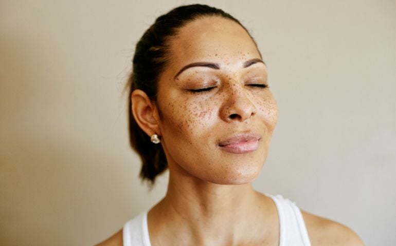 Close up of mixed race woman with eyes closed