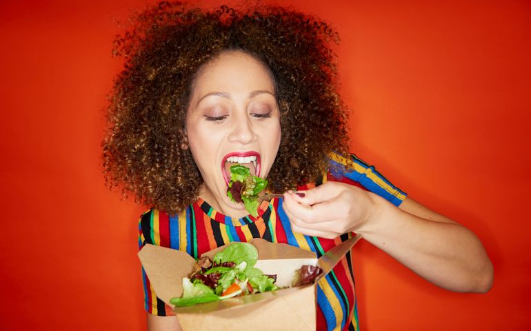 woman eating salad