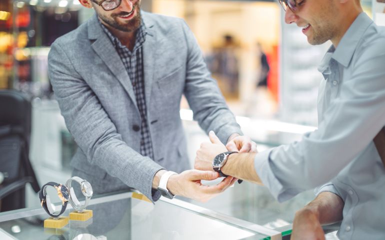 men shopping for expensive watch