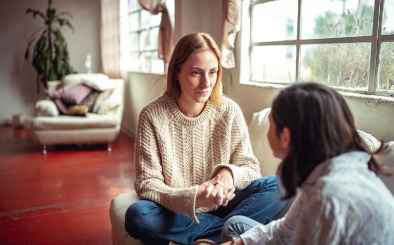 Mother and daughter having a talk.