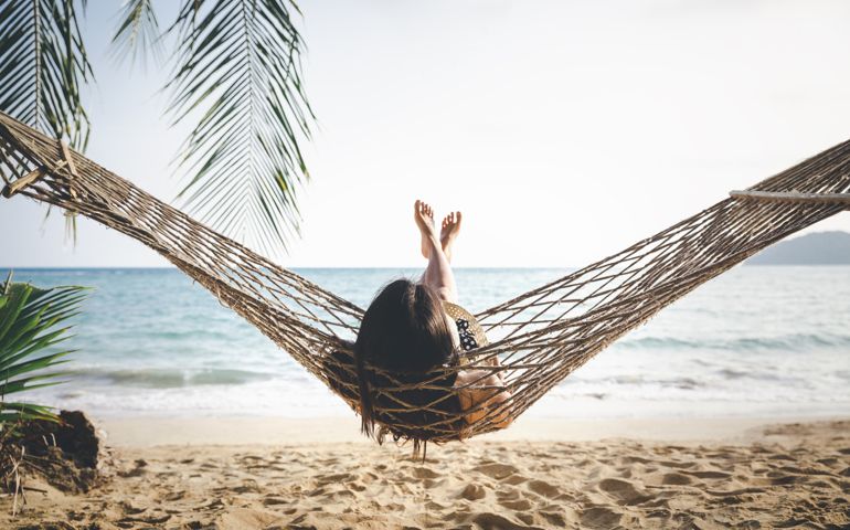 woman relaxing in hammock