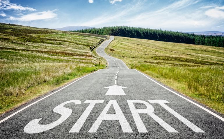 Start line on the road ahead disappearing into the distance