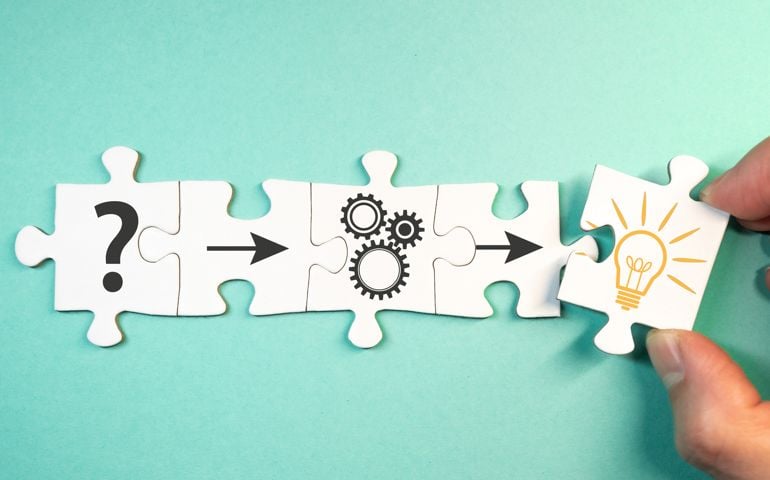 finding solution for a problem concept with jigsaw puzzle pieces