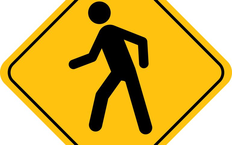 Human Figure Walking Street Sign