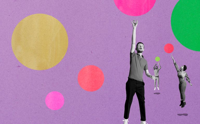 three people jumping for bubbles