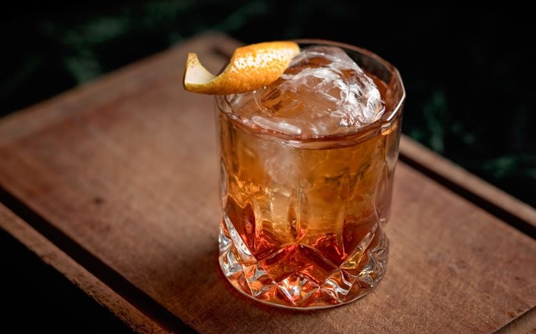 Old fashioned cocktail with an orange twist