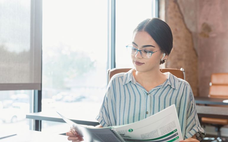 Businesswoman reviews documents