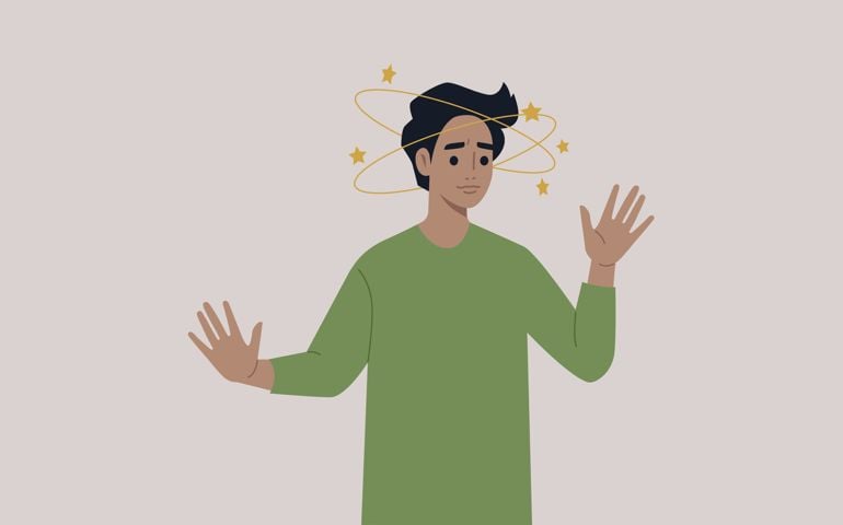 A young male character feeling dizzy with yellow stars orbiting around their head