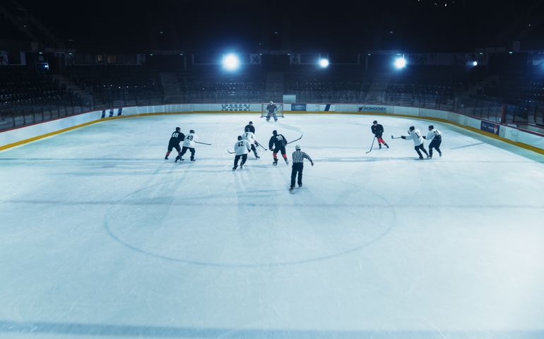 Ice Hockey Rink Arena: Great Team Attacks, Plays Pass Using Tactics and Creative Strategy. Player Masterful Dribbles. Beautiful Energetic Game from Team. High Angle Shot