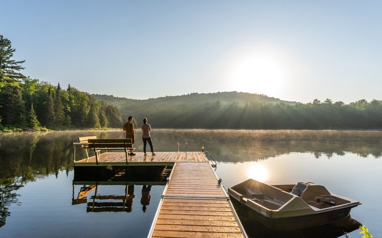 Couple on vacation by a lake.