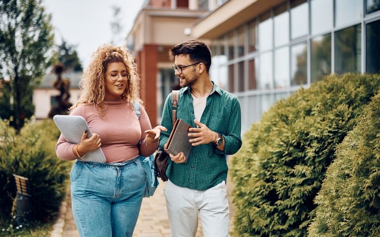 woman talking to classmate