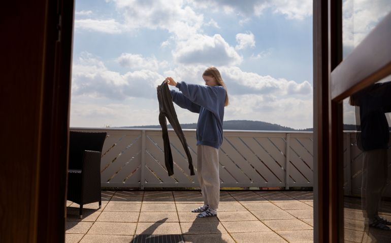 woman looking at sweatpants