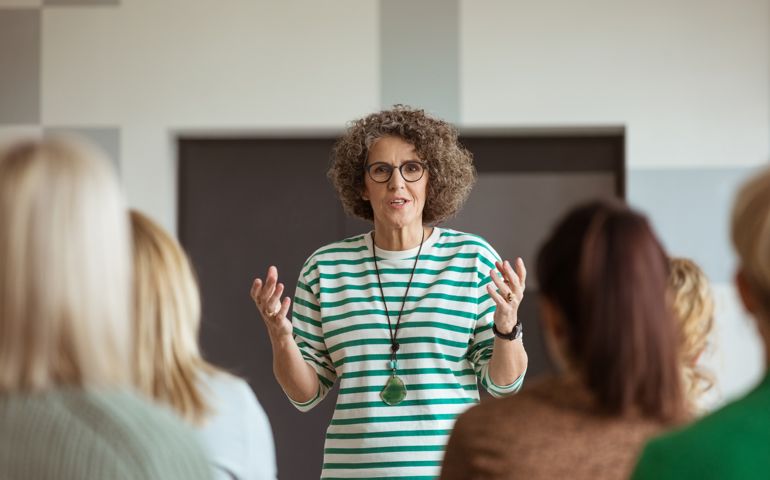 woman talking among group