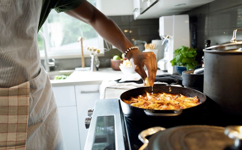 Close up of man cooking in kitchen