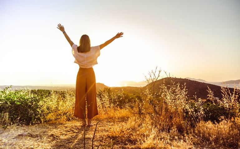 woman with hands in the air