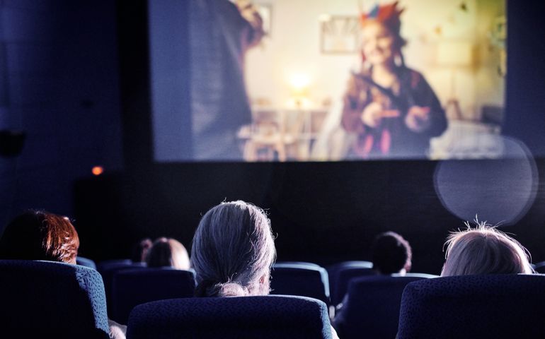 Watching Movie In Cinema