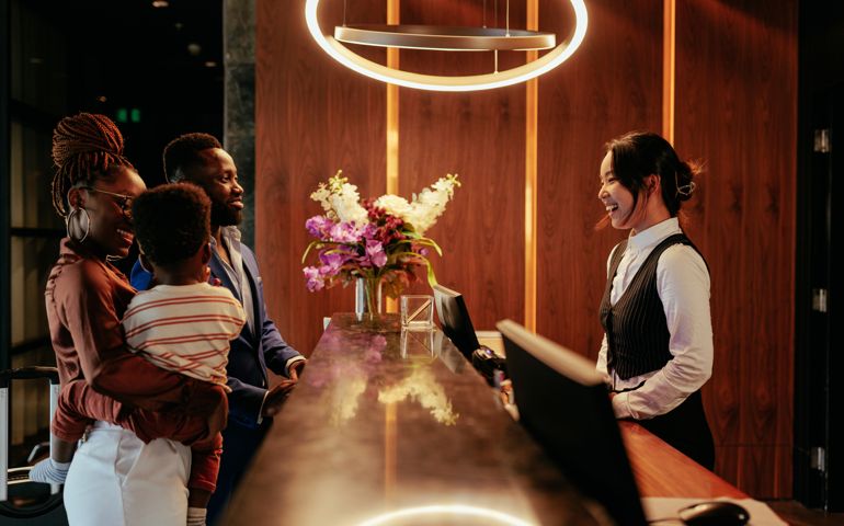 Busy front desk at hotel.