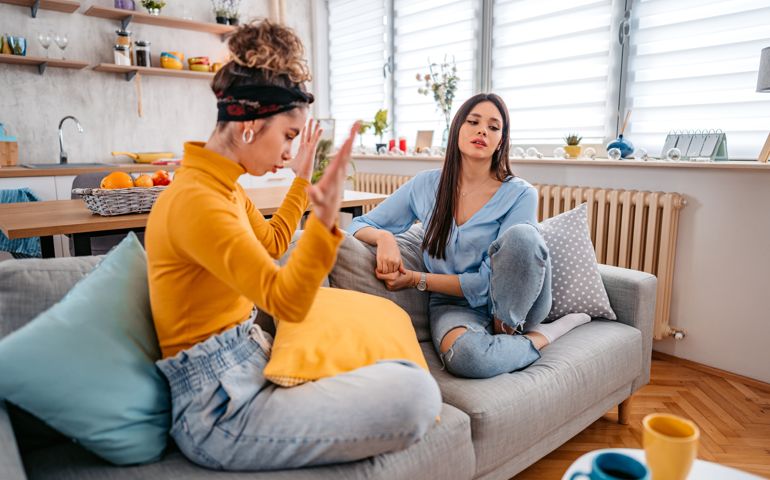 Two Young Women Arguing At Home