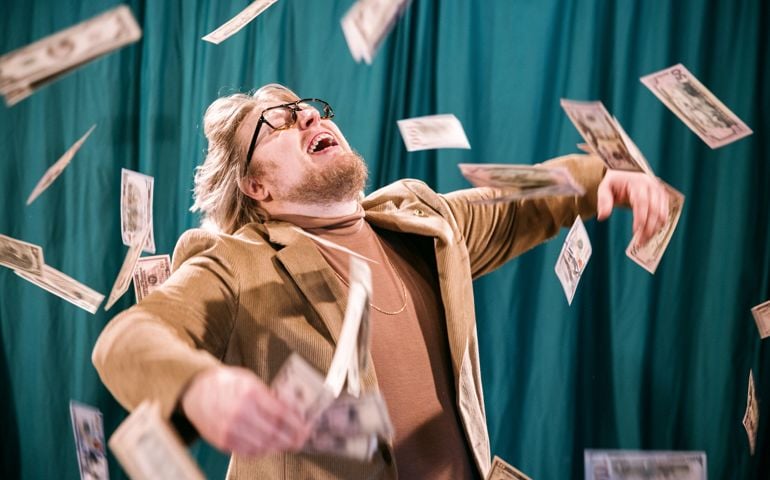 Retro Styled Man Celebrates in Falling Money