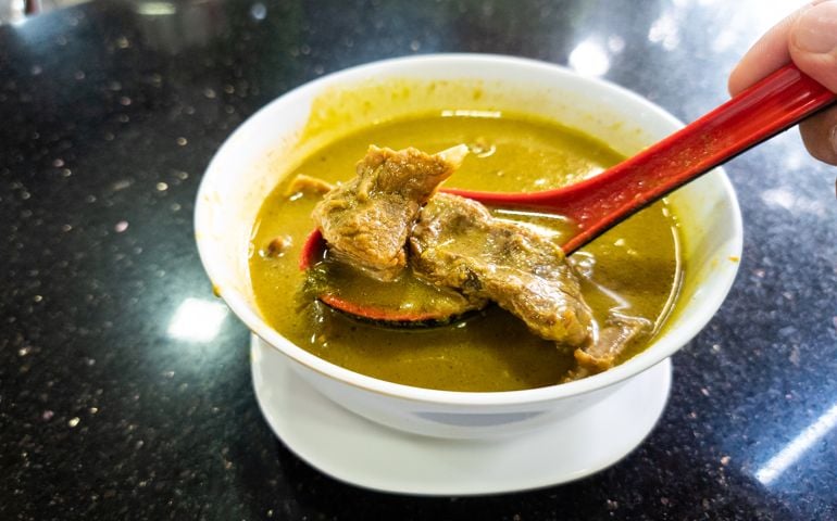 Sup kambing, or mutton soup is popular delicacy at mamak shop in Malaysia