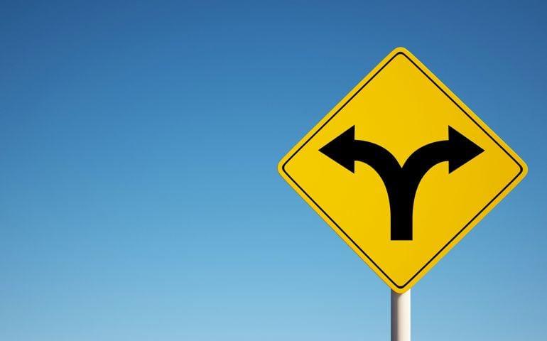 Sign with 2 dividing directions on blue sky clipping path
