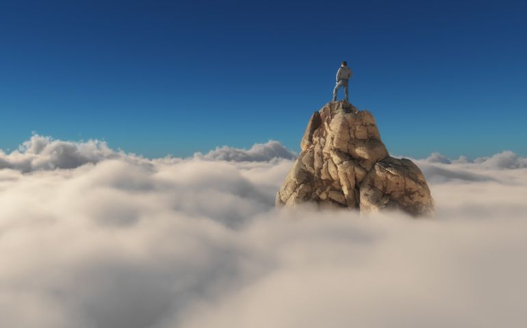 Man standing on a stone cliff