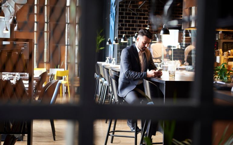 man waiting at the bar