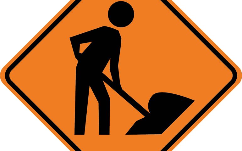 Men working road sign
