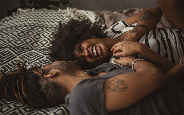 woman holding partners arm
