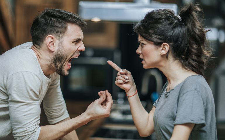 Furious couple arguing while having problems in their relationship.