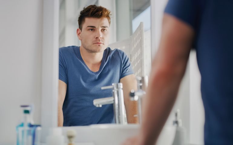 man looking in the mirror