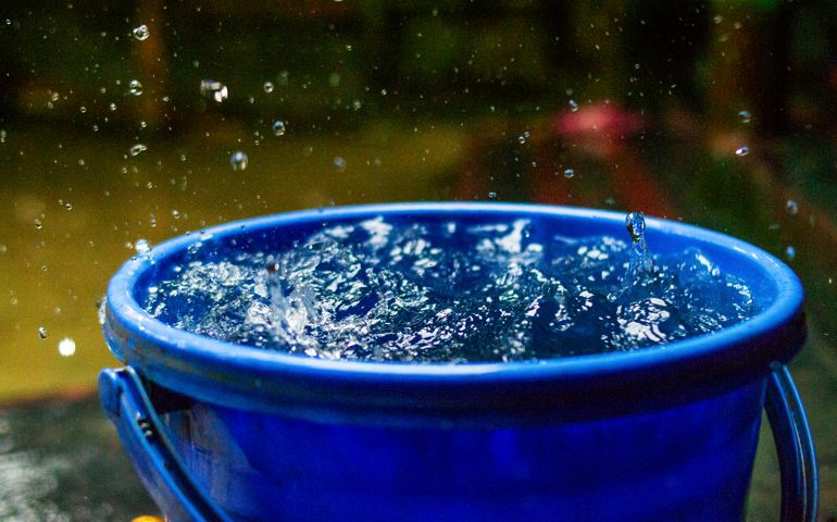 nature,rain,raindrop on a bucket