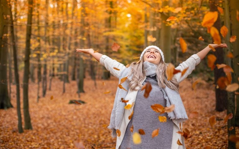 young woman enjoying autumn