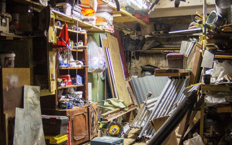 Big mess in an over stuffed suburban garage.