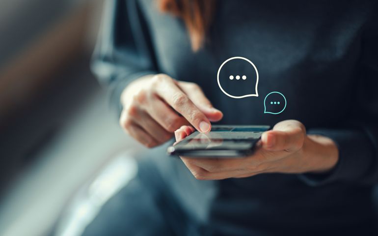 Women's hand typing on mobile smartphone, Live Chat Chatting on application Communication Digital Web and social network Concept.