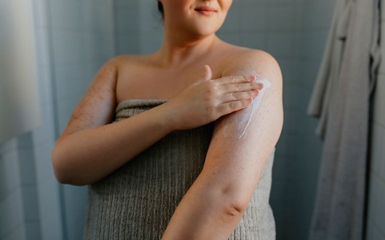 woman moisturizing