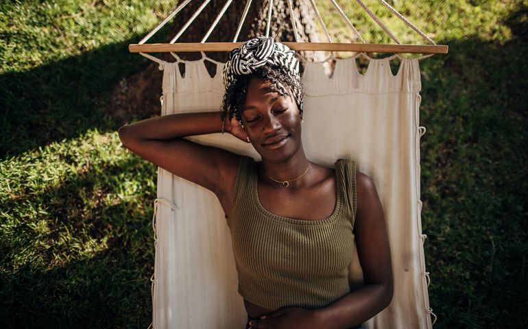 Woman relaxing in a hammock