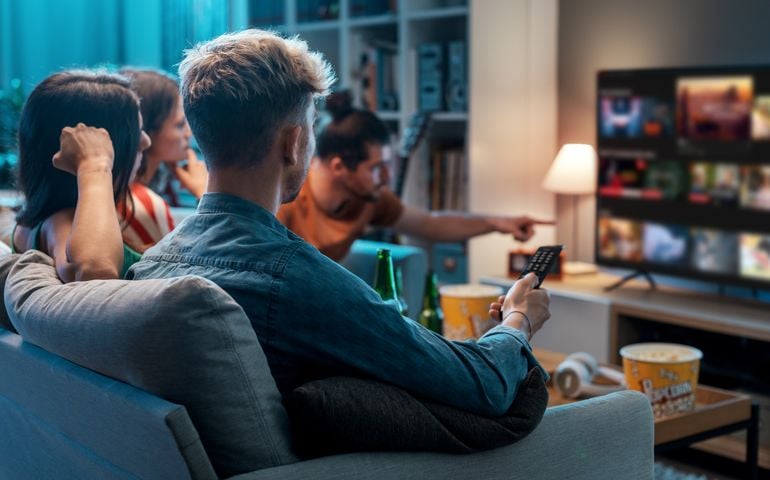 Friends watching movies together at home