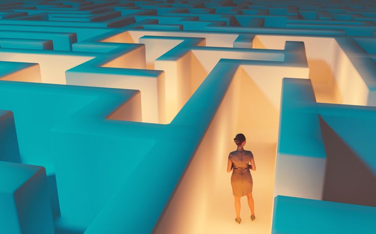 Woman looking for at way to escape maze