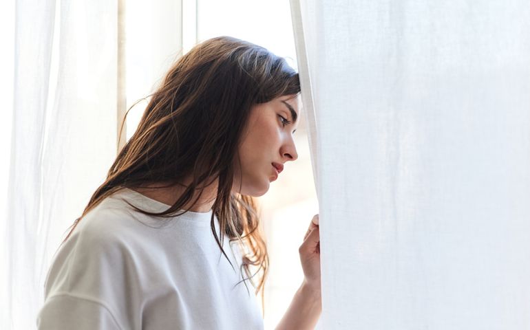 Portrait of a young woman with anxiety and depression problems.