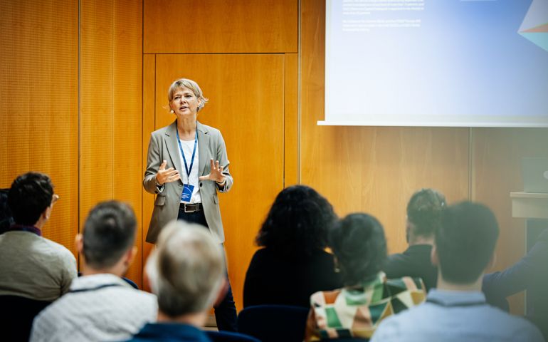 Presentation Being Given By Businesswoman At Conference