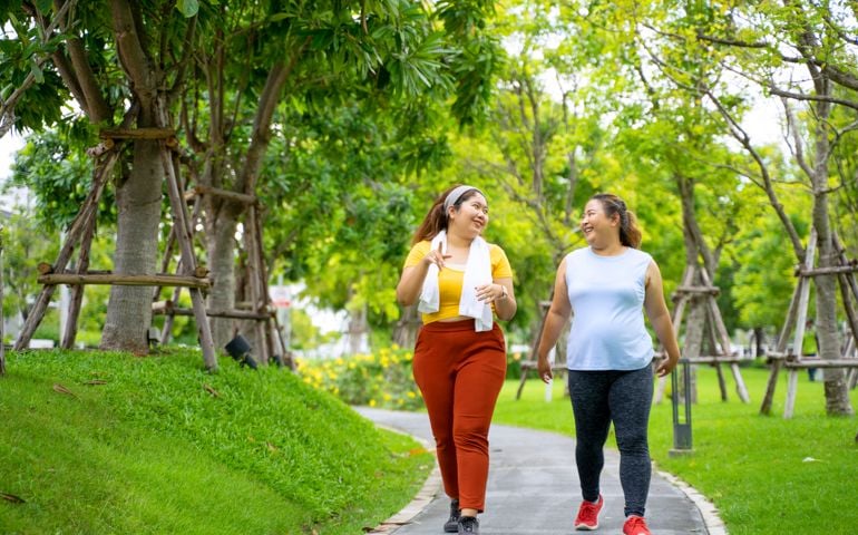 Group of people are going to work out at the park.