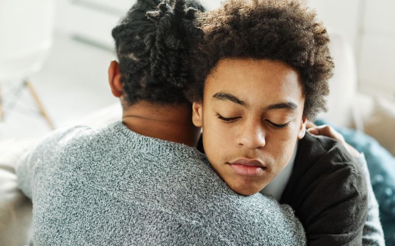 two men hugging