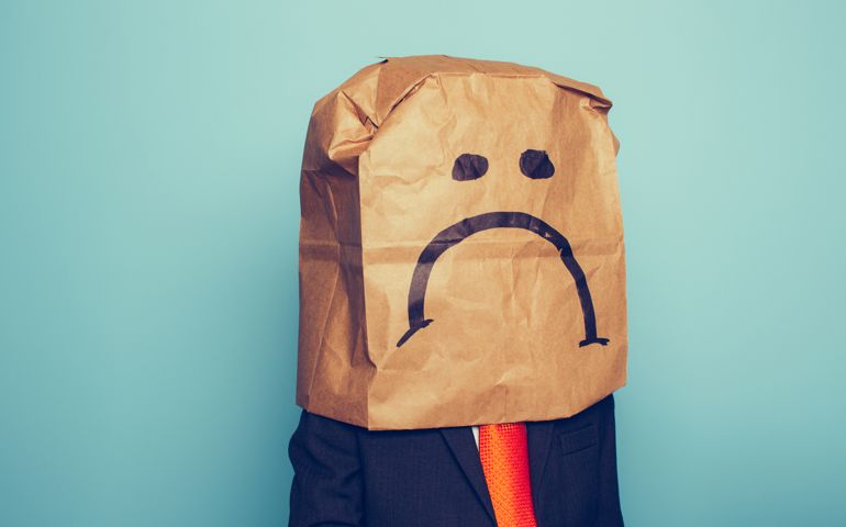 Young Boy Businessman Wears Sad Face