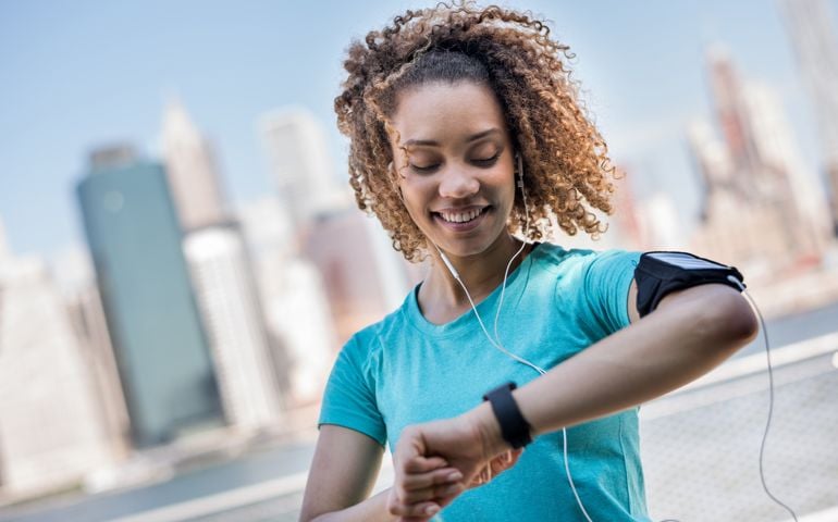 Sportive woman tracking her workout progress