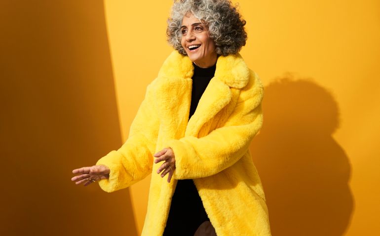 Portrait of a mature woman dancing and laughing
