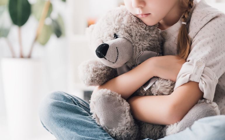 child with teddy bear