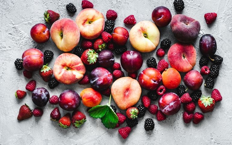 Various types of fruits on white background