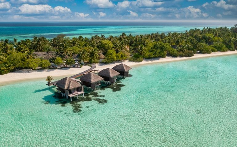 Maldives paradise scenery. Tropical aerial landscape, seascape with long jetty, water villas with amazing sea and lagoon beach, tropical nature. Exotic tourism destination banner, summer vacation