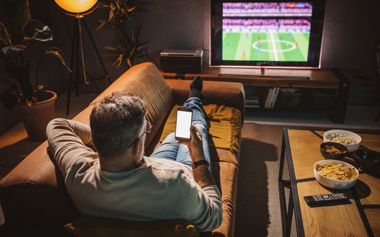 Watching soccer game at home